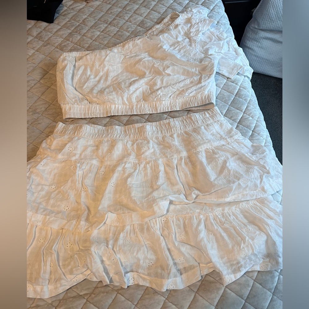 Two piece white eyelet one shoulder top and lined skirt. Size XL